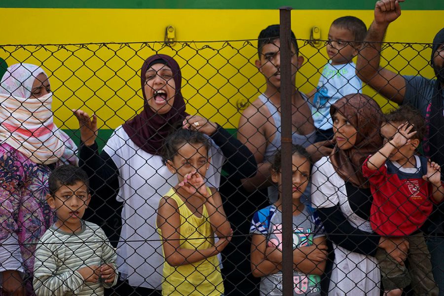 Women_and_children_among_Syrian_refugees_striking_at_the_platform_of_Budapest_Keleti_railway_station._Refugee_crisis._Budapest,_Hungary,_.jpg